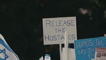 Release the hostages sign at a support Israel rally