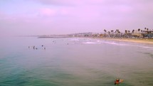 surfers catching waves at Newport Beach 