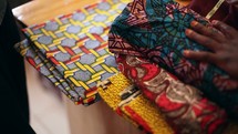seamstress sewing African Fabric in Uganda 