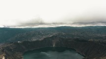 Volcanic Crater Lagoon Of Quilotoa, Quito Region, Ecuador - aerial drone shot	