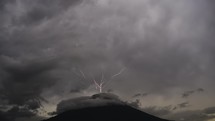 Thunder and lightning over volcano during a cloudy day in Guatemala	