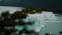 Perito Moreno Glacier With Crevasse Revealed Behind Foliage In Santa Cruz Province, Argentina. parallax