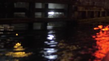Close up view of river wave on moving boat at night