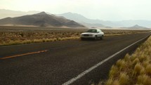passing car on a desert road