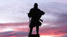Denver statue at dusk 