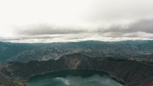 Panoramic view of wonderful crater lake landscape surrounded by volcanoes in Ecuador	