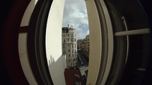 Timelapse of traffic in Parisian street, clouds sailing in the sky