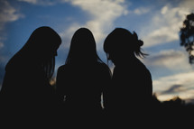 Silhouette of women praying