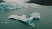 Iceberg On Argentino Lake At Terminus Of Perito Moreno Glacier In Argentina. tilt-up shot	