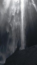 Waterfall flows among the rocks