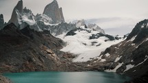 Laguna de los Tres With Calm Blue Water Overlooking The Fitz Roy Mountain in Patagonia, Argentina. - wide shot