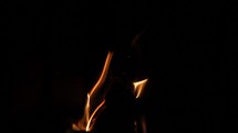 Flames Licking Around a Log in a Fireplace and Getting Brighter - Slow Motion