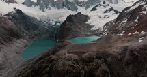 Monte Fitz Roy With Glacial Lagoons At Its Base. Santa Cruz, Patagonia, Argentina. drone tilt-up shot