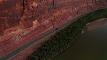 Car driving by Colorado River, aerial view	