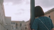 Girl standing in the streets of Italy