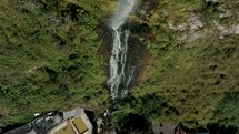 Aerial Drone shot of Cascada Manto de la Novia With Water Cascading On Lush Mountains In Baños de Agua Santa, Ecuador.