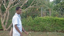 teen boy walking to school in Papua New Guinea 