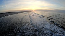 Aerial close-up drone shot of the shore of Langeoog Island, Germany, at the sunset