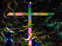 dramatic cross on colorful dark bokeh background 