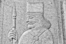 carving of a warrior in stone 