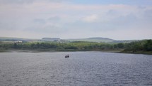 Two People Fishing in a Boat on Vartry Reservoir, County Wicklow, Ireland