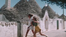 Two girls walking in the streets of Italy