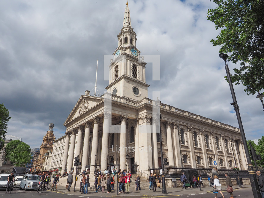 LONDON, UK - JUNE 09, 2015: Tourists in front of the Church of Saint Martin in the Fields in Trafalgar Square