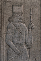carving of an antique warrior 
