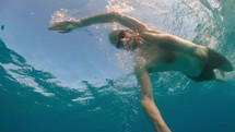 Athlete trains swim in water for sports competitions