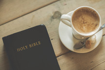 Bible and latte on a table 