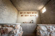 Model empty stone Easter resurrection tomb with bread and wine where Jesus rose from the dead 