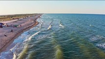 Aerial View of Sandy Beach and Ocean Waves 4K Drone Footage

