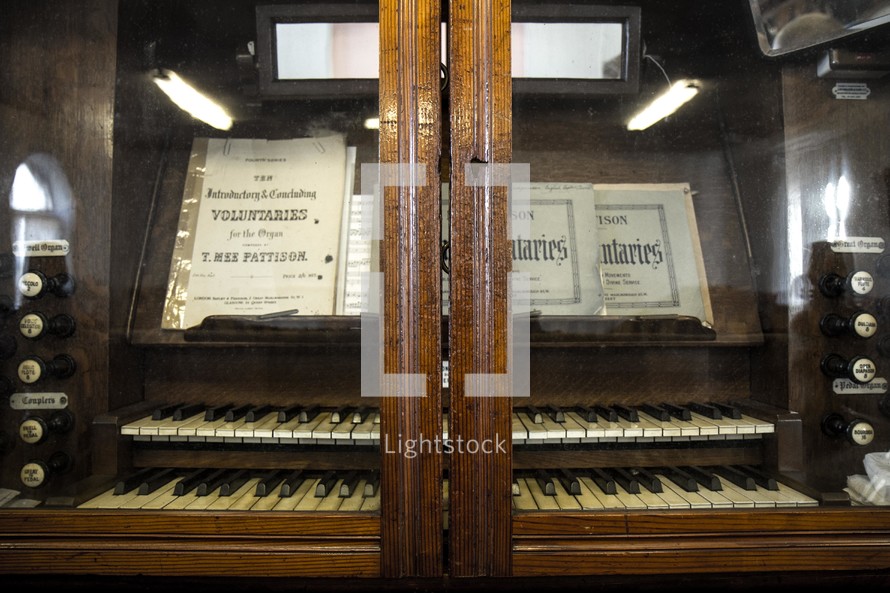 organ behind glass doors 