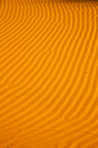 Lines in desert sand formed by the wind.