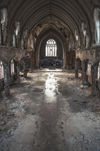 Sanctuary shot of a deteriorating and abandoned church.