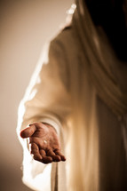 The resurrected Christ -- Jesus extending His hand with an invitation to follow Him.