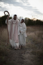 Joseph and Mary walking towards Bethlehem