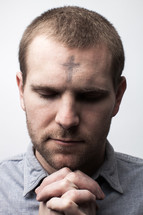 A man with ashes on his forehead for Ash Wednesday