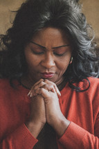 Woman in prayer.