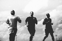 Men running on a track.