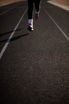 runner's feet on a track 