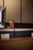 A smiling soundboard operator.