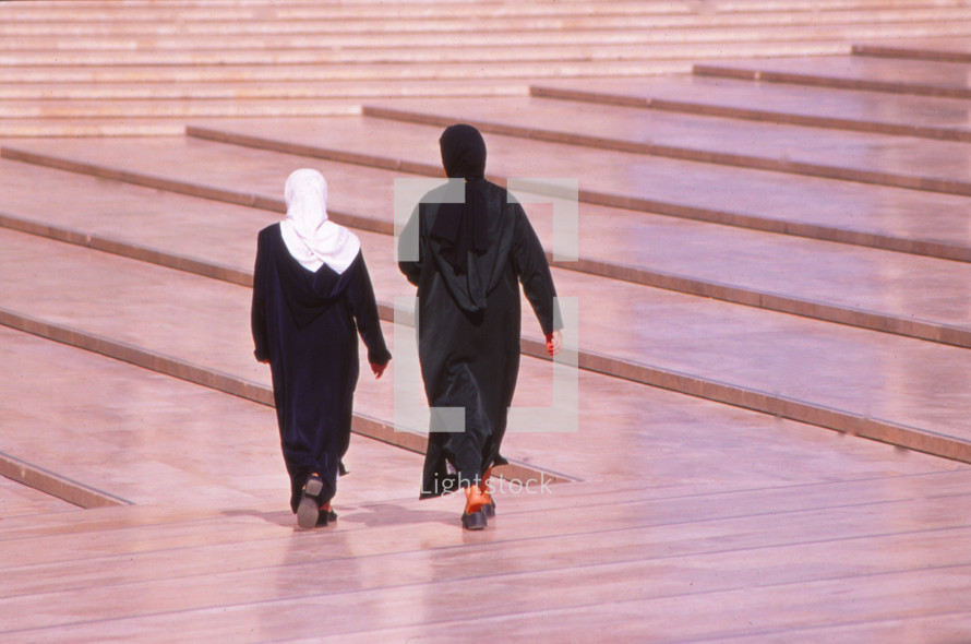 Muslim women walking at a mosque 