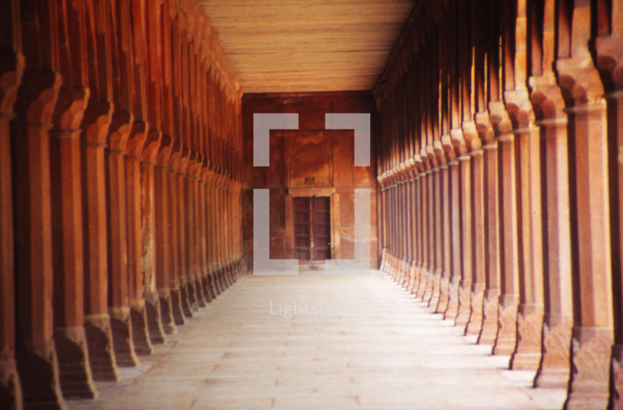 a hallway and rows of columns 