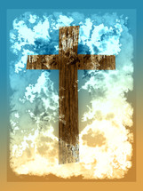 brown wood cross on turquoise blue to sandy tan background with cloud effect