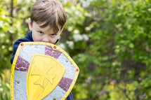 a child with a shield 