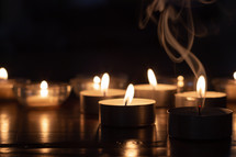 candles on a wood table 