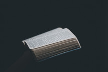 Bible on black background