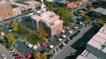 aerial view over a downtown area and courthouse 