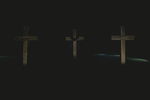 three crosses in darkness 